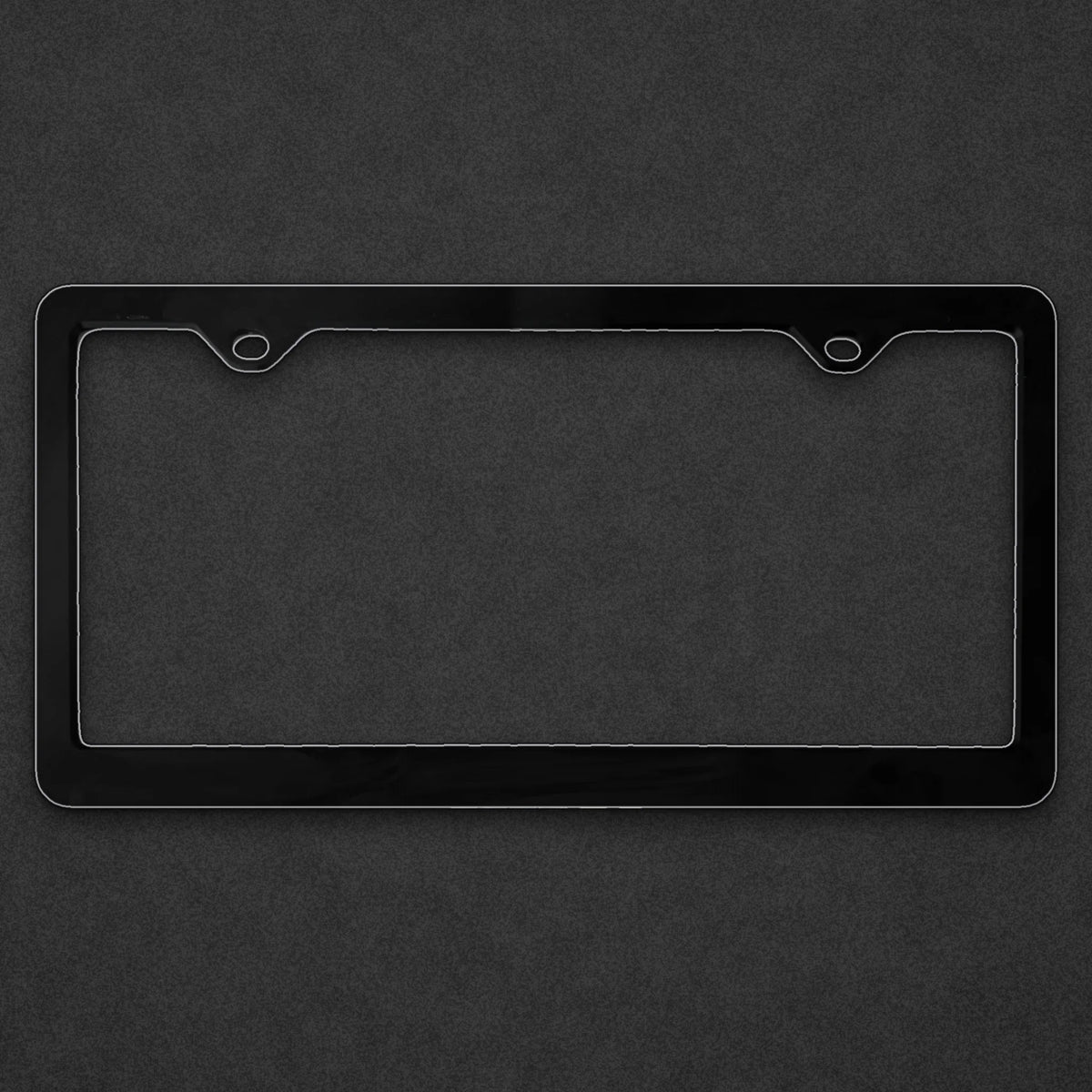 Blank black license plate frame on a charcoal textured background