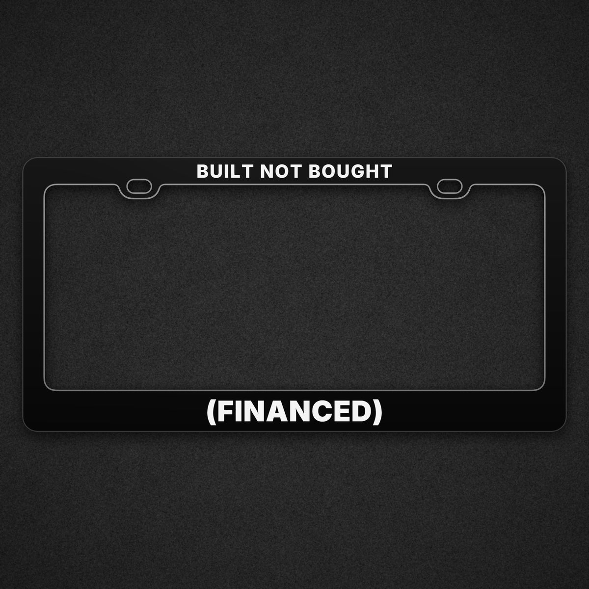 Black (FINANCED) plate frame with BUILT NOT BOUGHT across the top